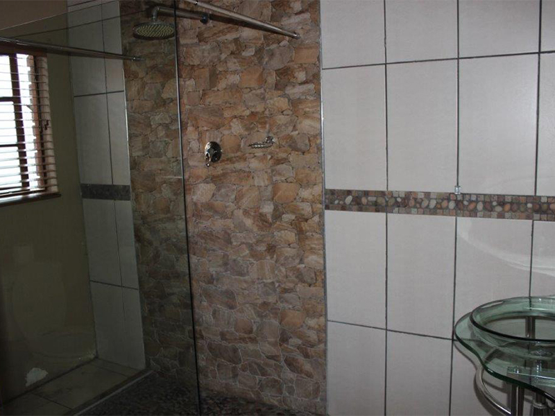 bathroom orange sunbird room